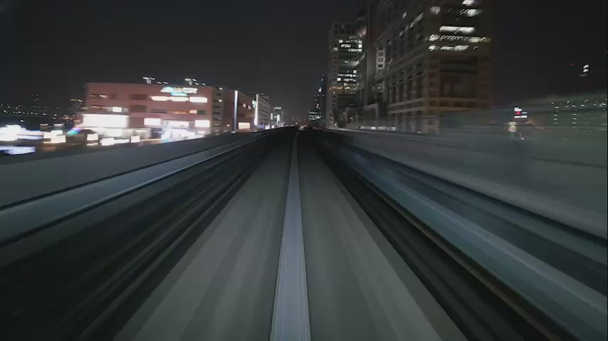 Night-time metro train timelapse background loop